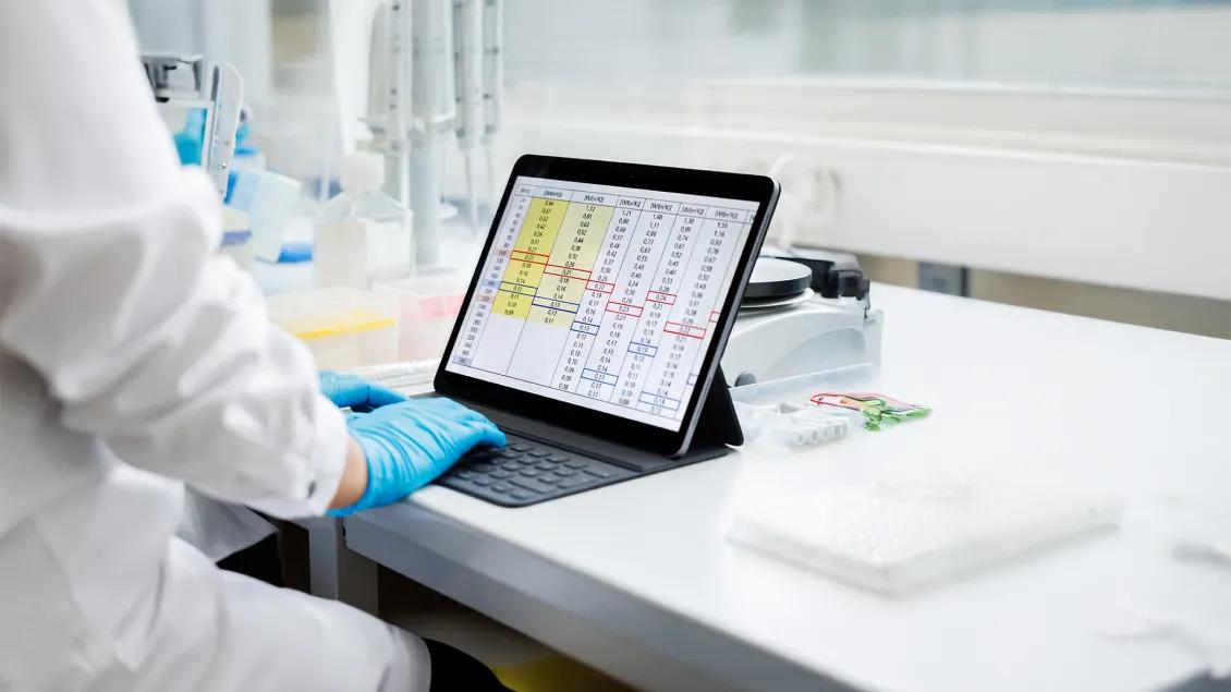 researcher working on computer in a lab