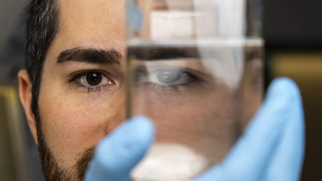 Chris looking through a reagent bottle