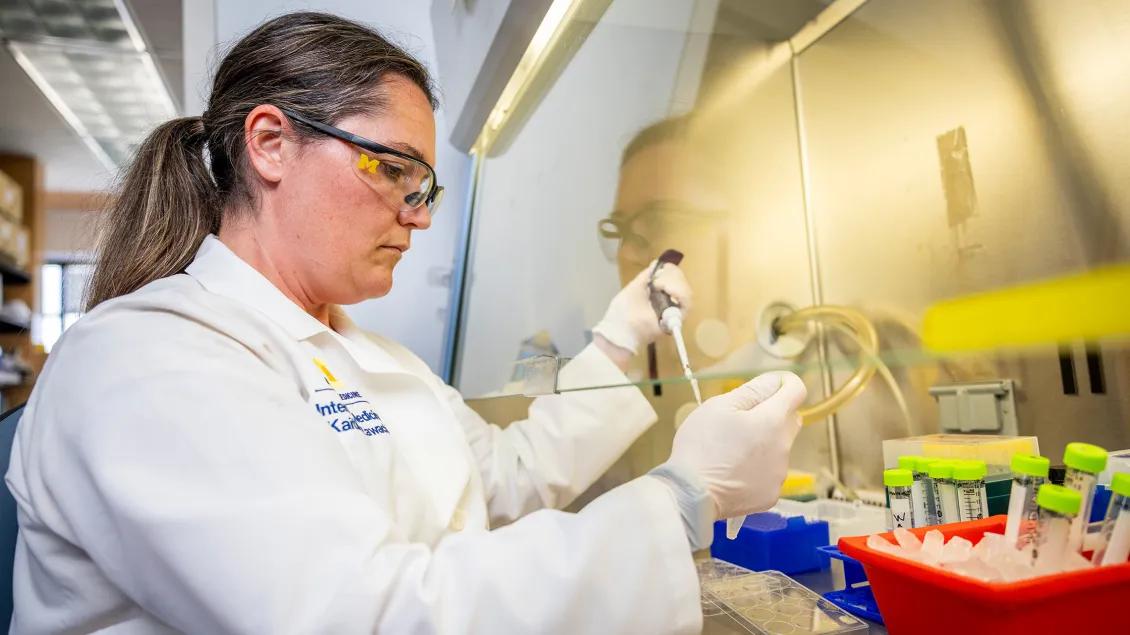 genetic medicine doctor in lab pipeting