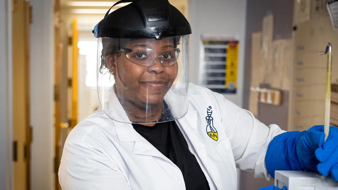 genetic medicine doctor with face shield smiling