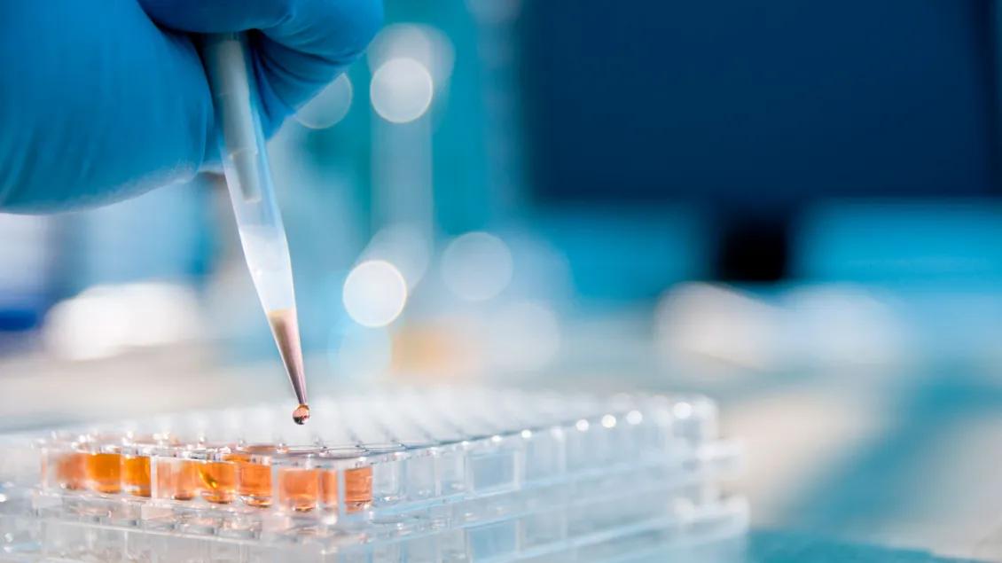 Scientist pipetting