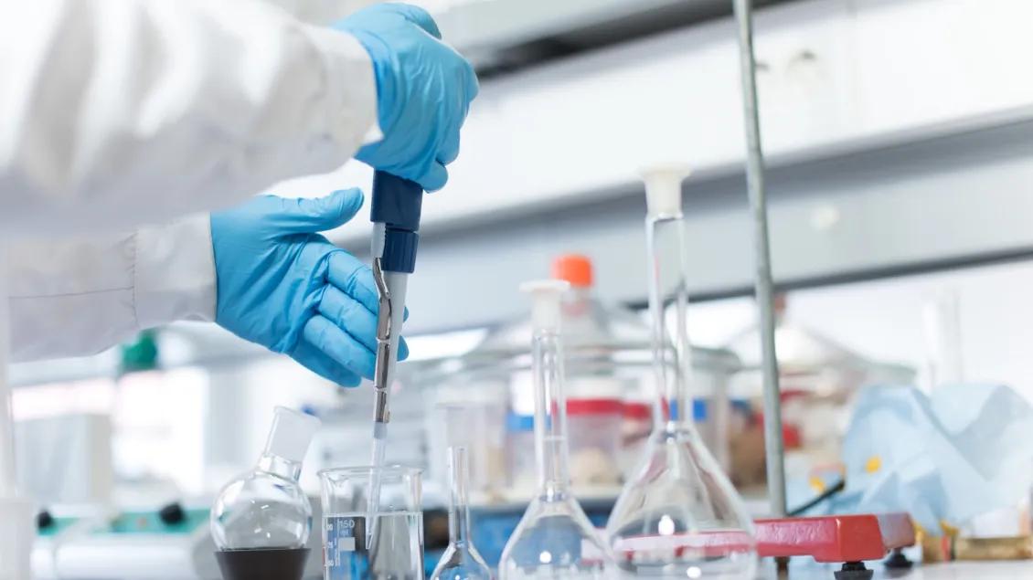 Person working with equipment in a lab