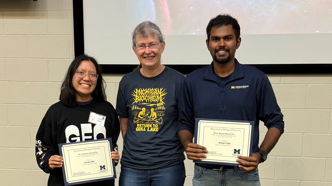 students holding award certificates