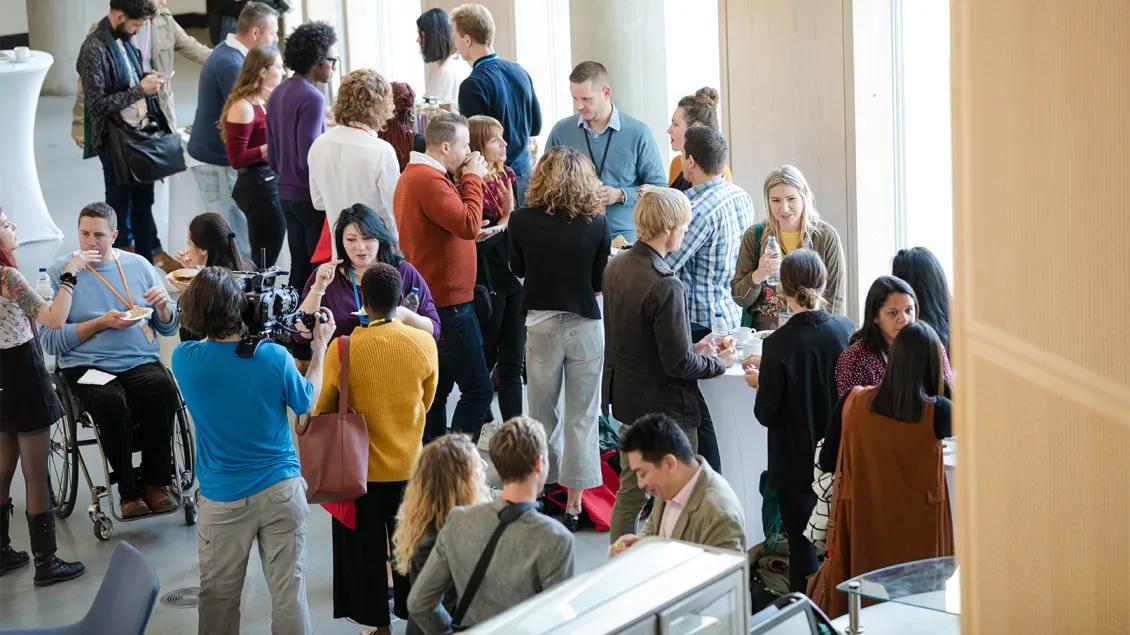 group of people talking after an event