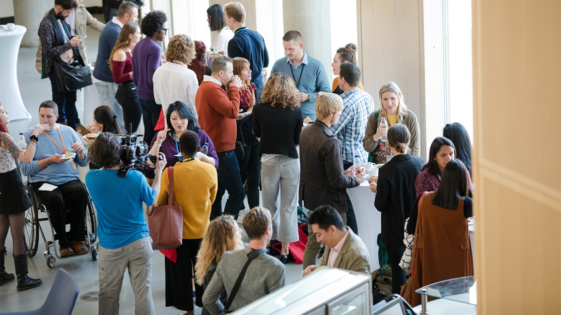 group of people talking after an event