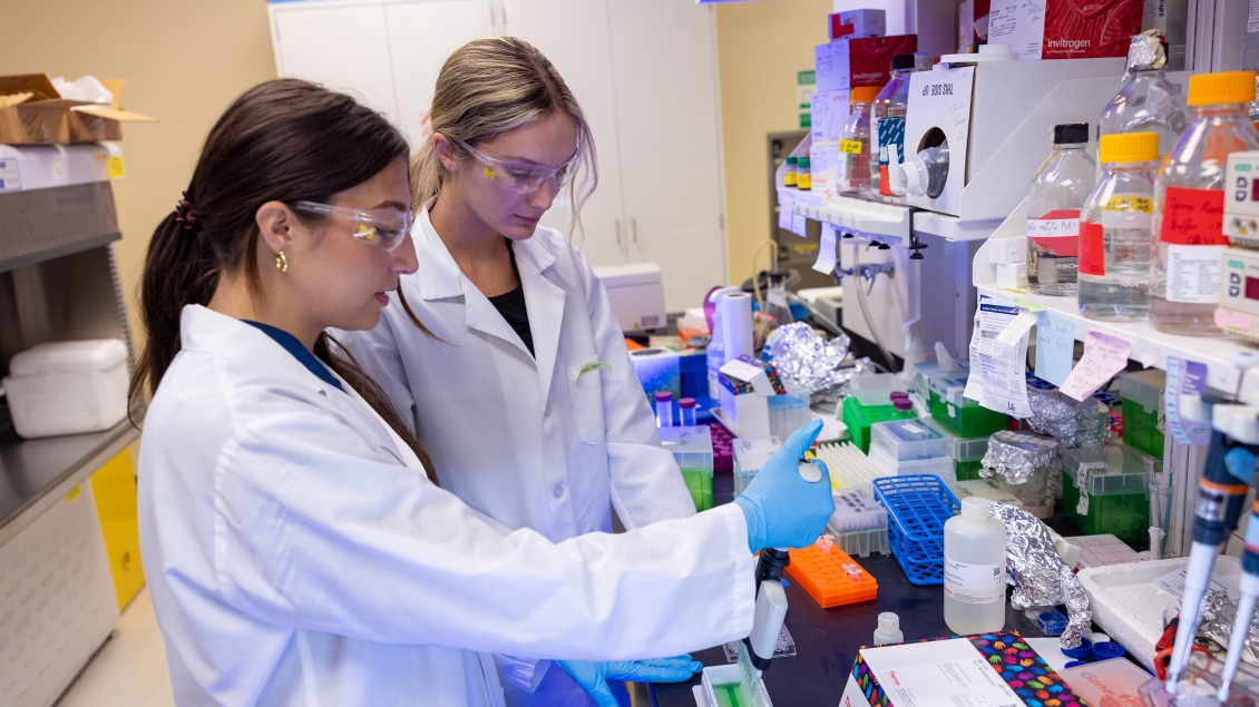 Lab member working with equipment in the lab
