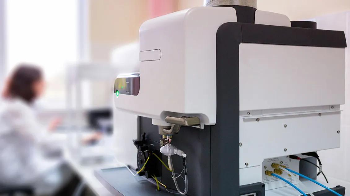 Mass spectrometer with woman technician