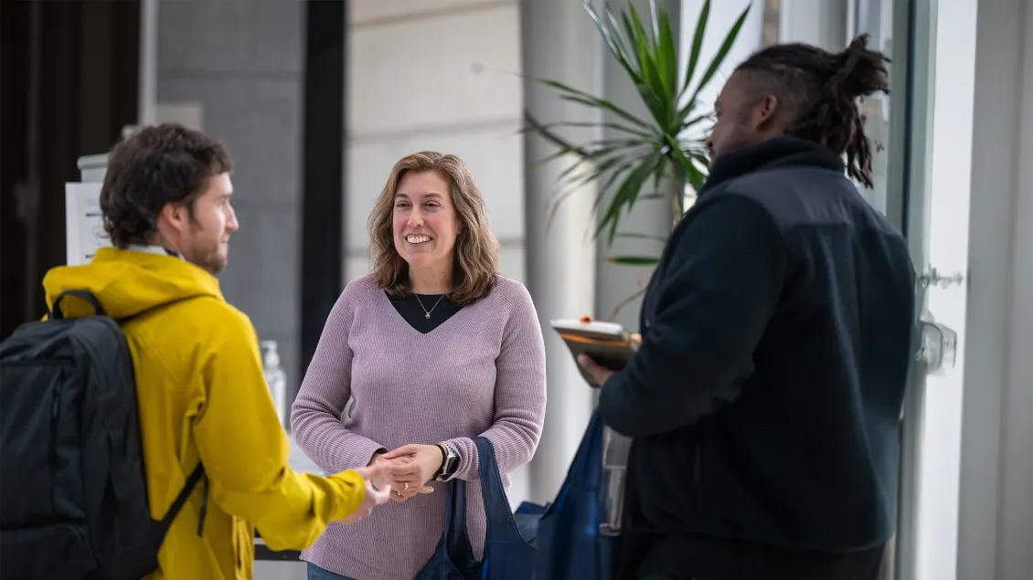 people talking in a group and smiling