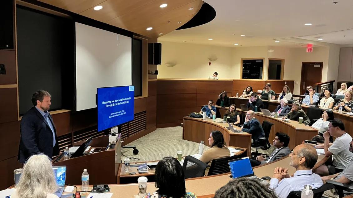 A group of people in a lecture room