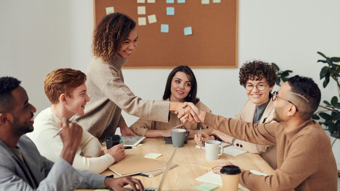 People meeting at table for research