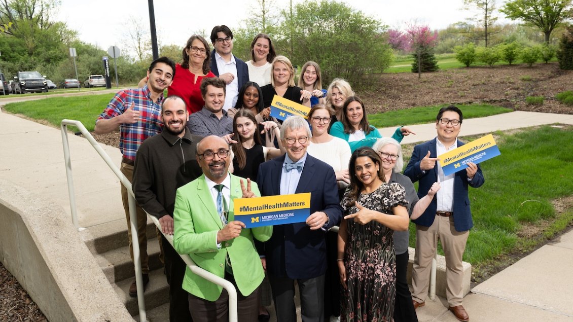 A group of people standing on a set of stairs after attending a conference for the Department of Psychiatry