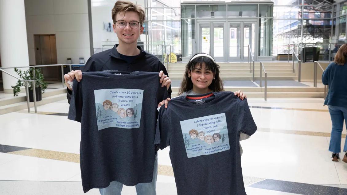 CPOD learners holding t-shirts