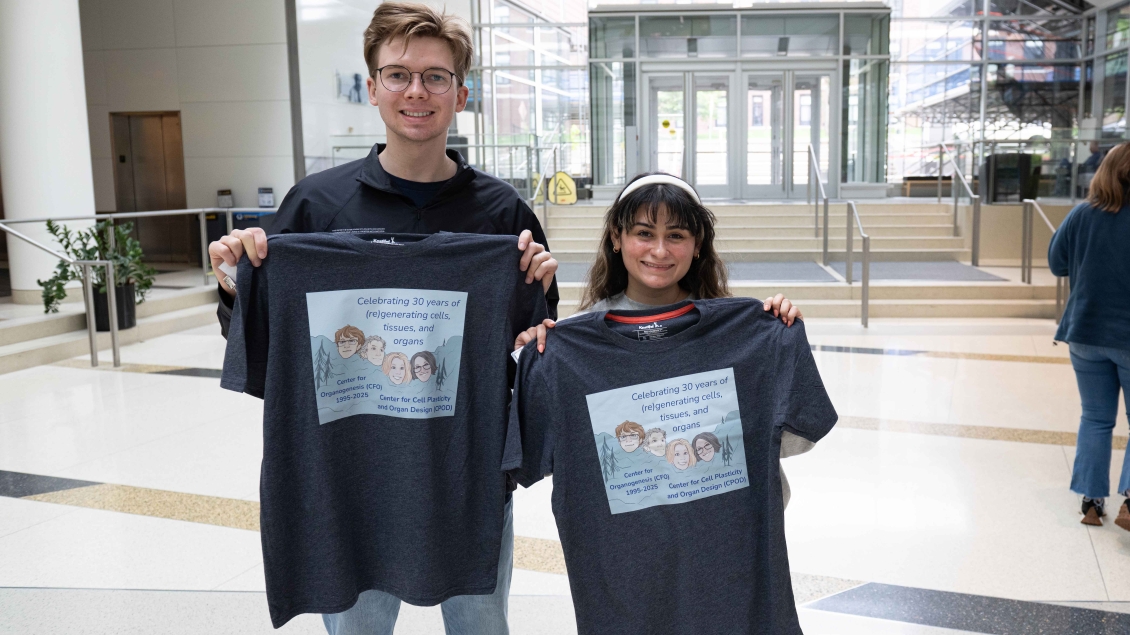 CPOD learners holding t-shirts