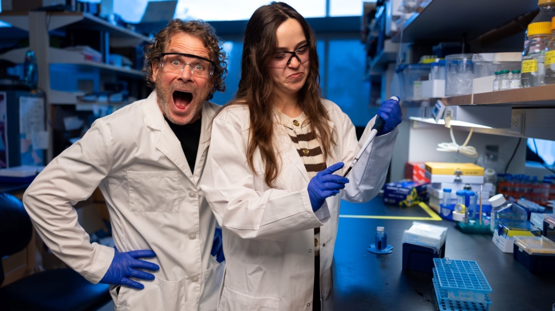 Gary Hammer and lab member using a micropipette