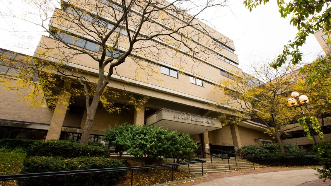 Photograph of UH South entrance in the fall with yellow leaves surrounding the building