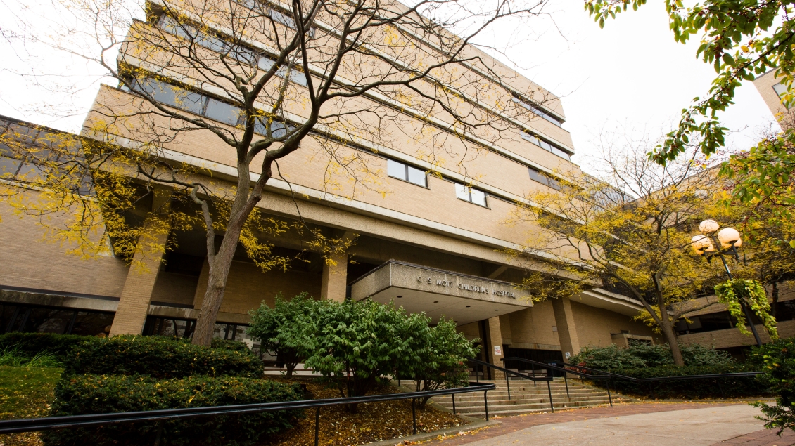 Photograph of UH South entrance in the fall with yellow leaves surrounding the building