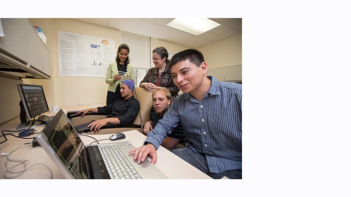 DBI Lab team working with computers in an office