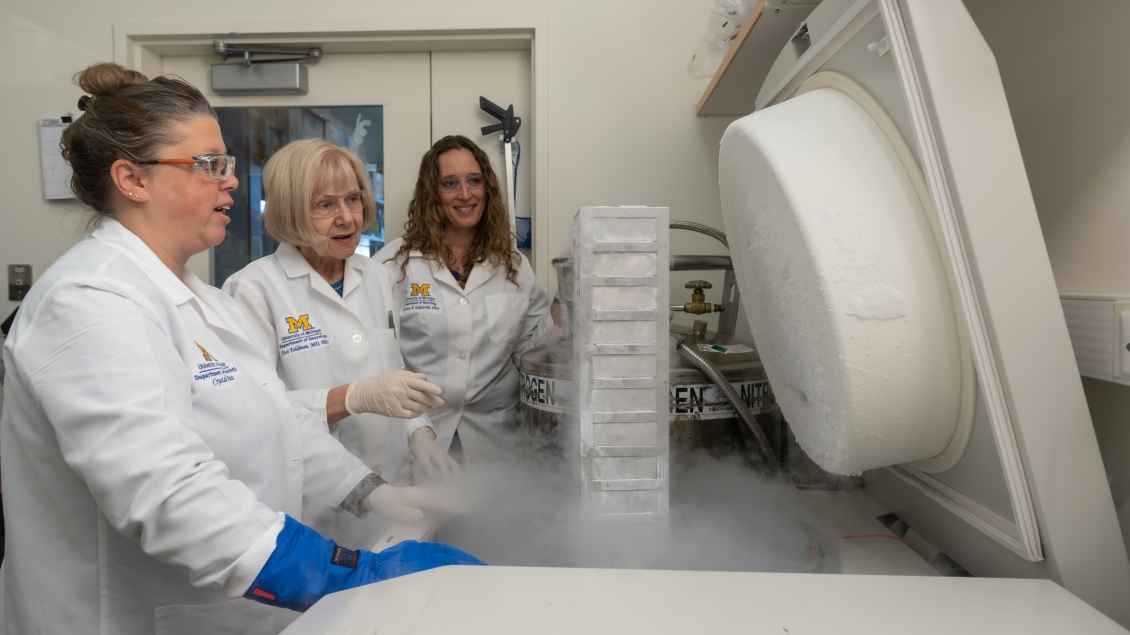 Crystal Pacut with Drs. Eva Feldman and Stacey Jacoby looking at samples in the lab