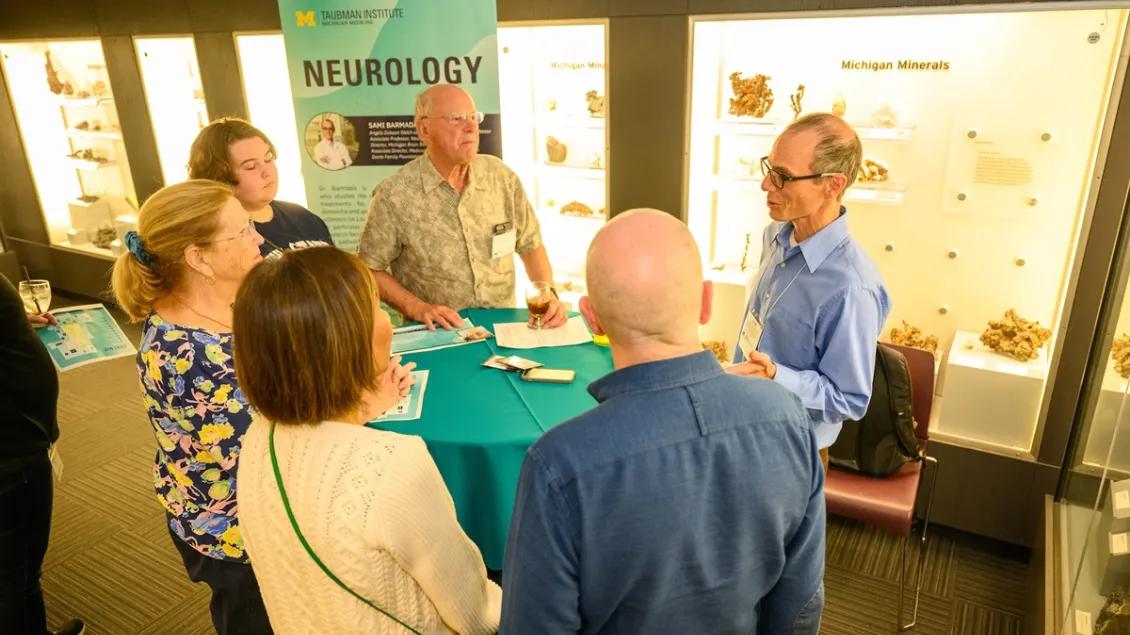 Dr. Sami Barmada talks with guests from the public at a 2024 outreach event