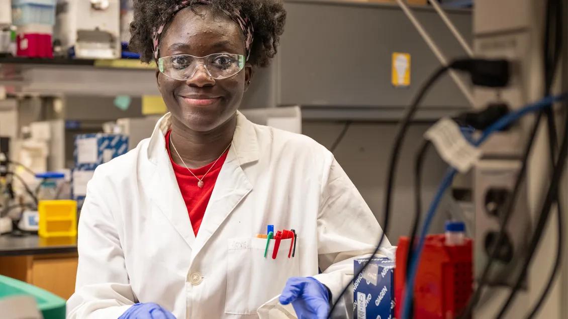 PhD student working in a lab