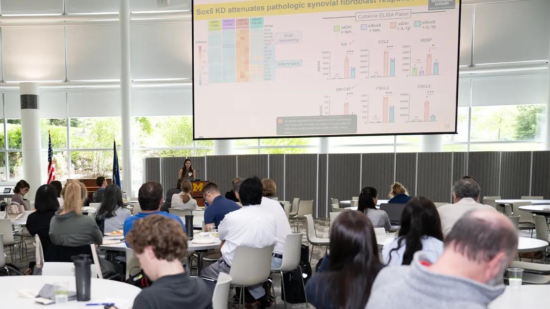 group of people attending an event and listening to the speaker