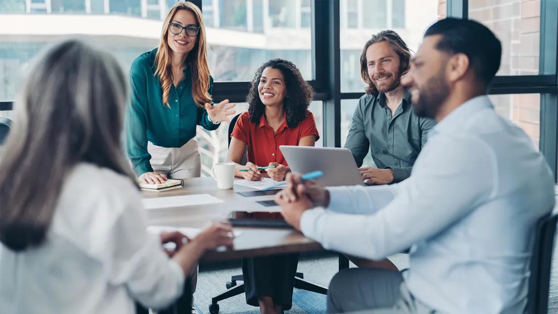 group of people in a conference room meeting