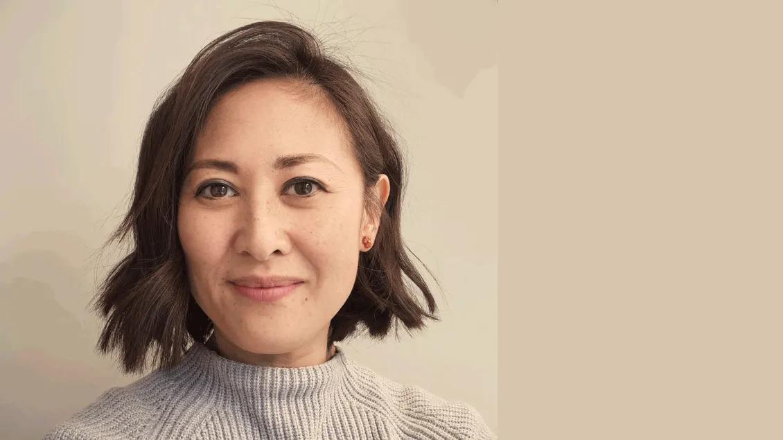 Grace L. Wu, MS, managing director of Michigan Medicine's Taubman Institute, a woman with cropped dark hair wearing a beige sweater