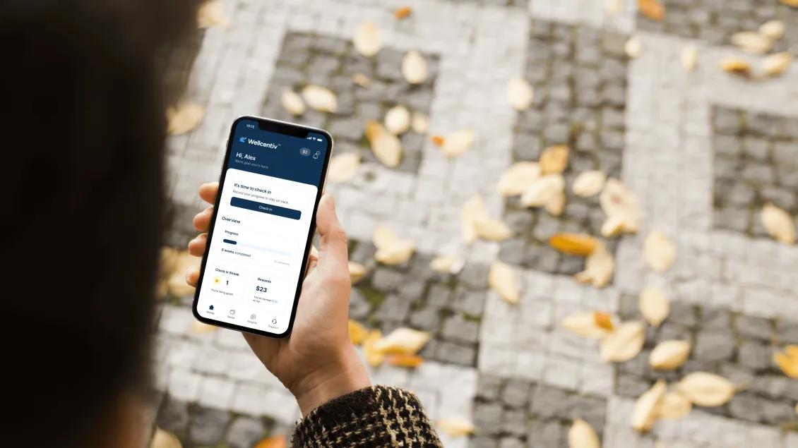 close-up of the WELLCENTIV app on a phone