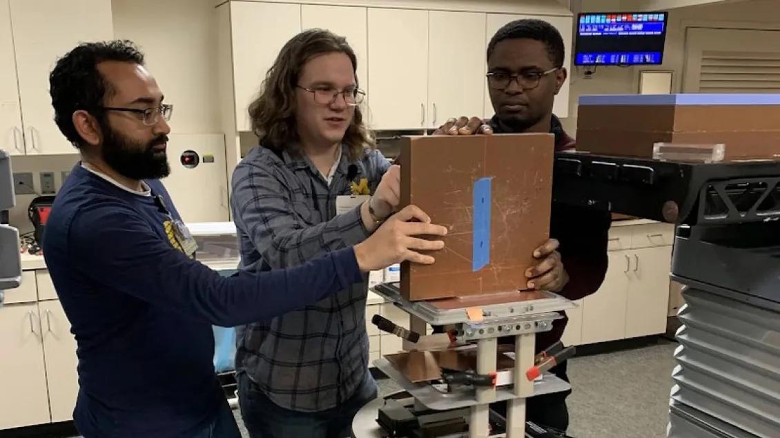 Trainees working on an experiment