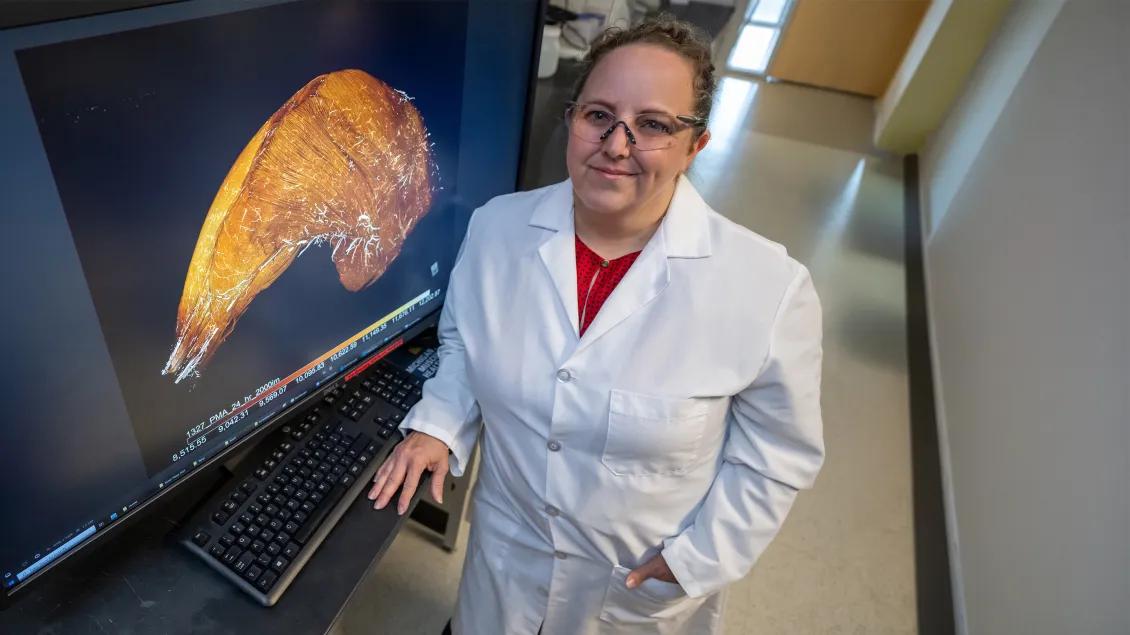 researcher posing for a photo in a lab