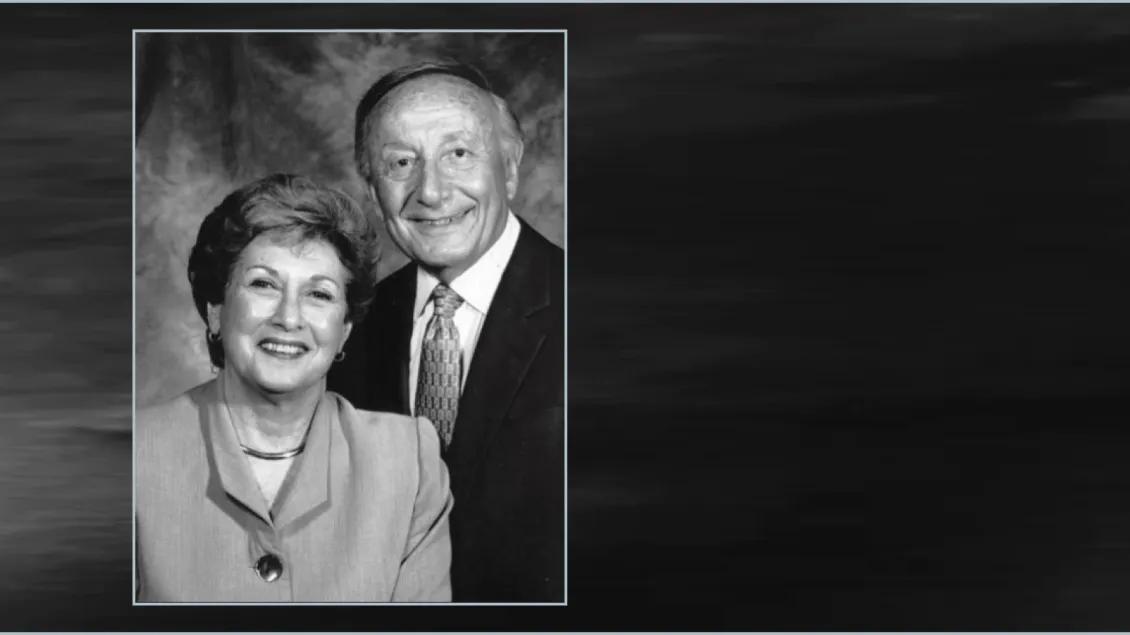 two people posing for a photo in black and white