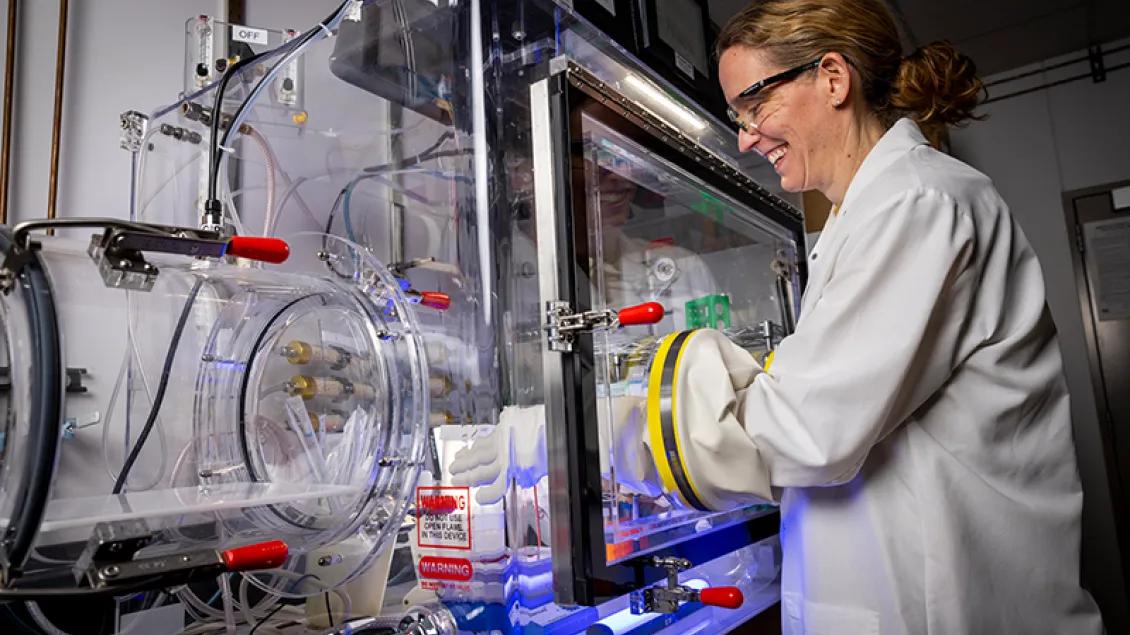 Infectious diseases researcher using equipment in the lab