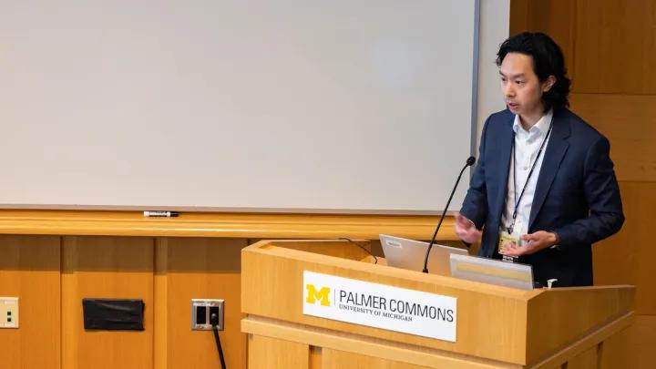 speaker at palmer commons on research day 
