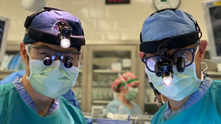 Two surgeons wearing masks