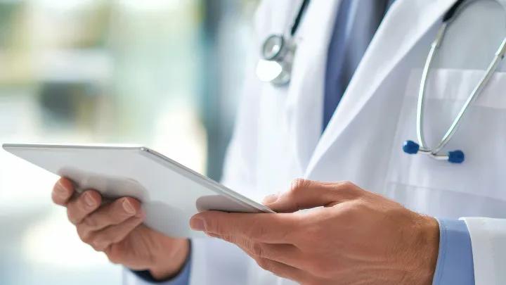 Doctor hands holding a tablet