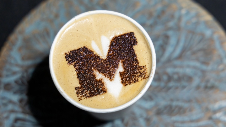 coffee cup with U-M logo art