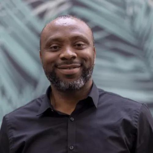 a Nigerian man wearing a black shirt
