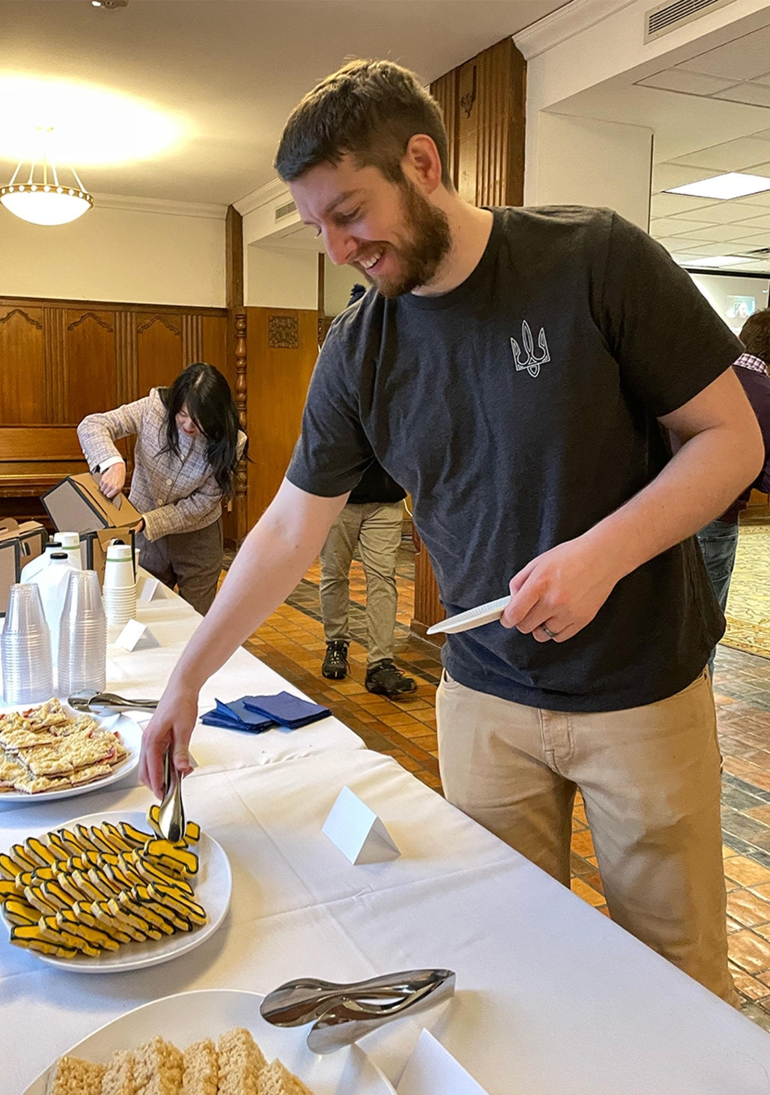  Man reaching for block M cookies 