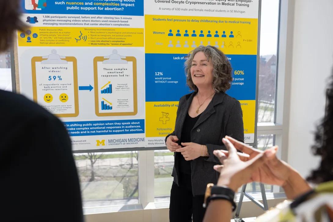  people listen to woman a while viewing content from obgyn posters from research day 