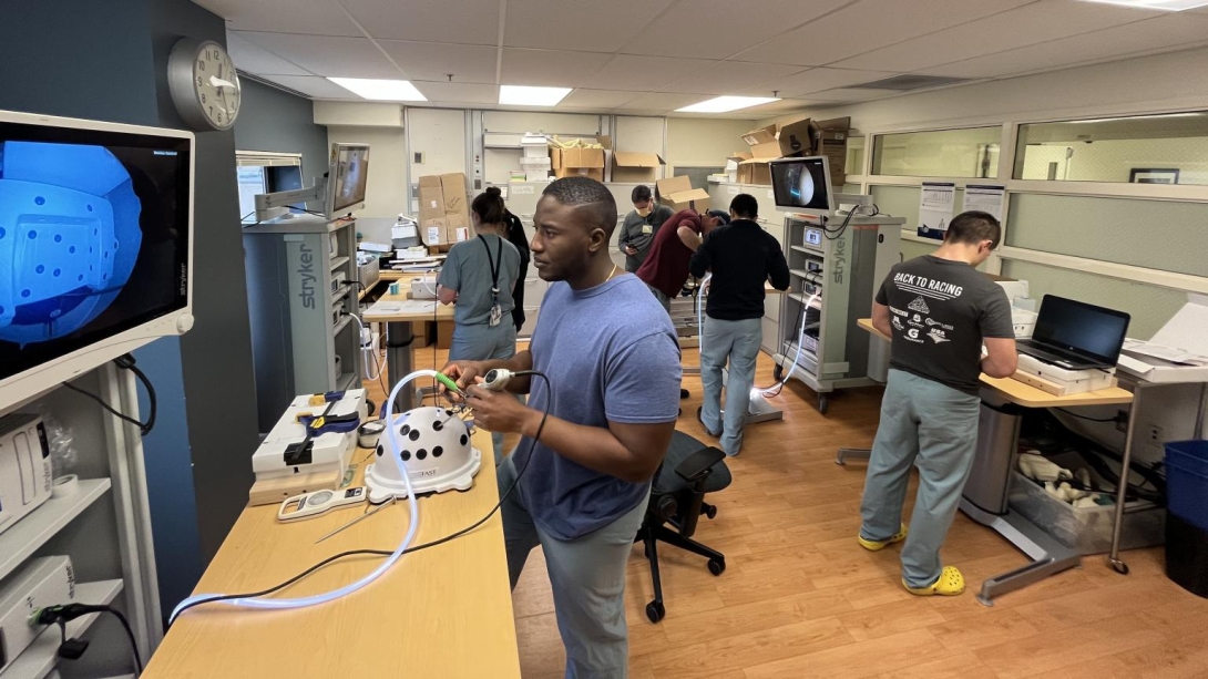 Student care practicing their skills in a simulation room 