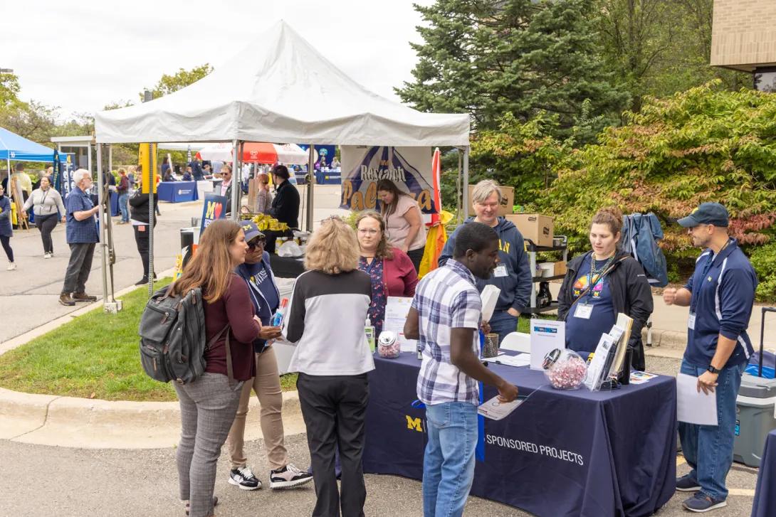 people at Researchpalooza event outdoors