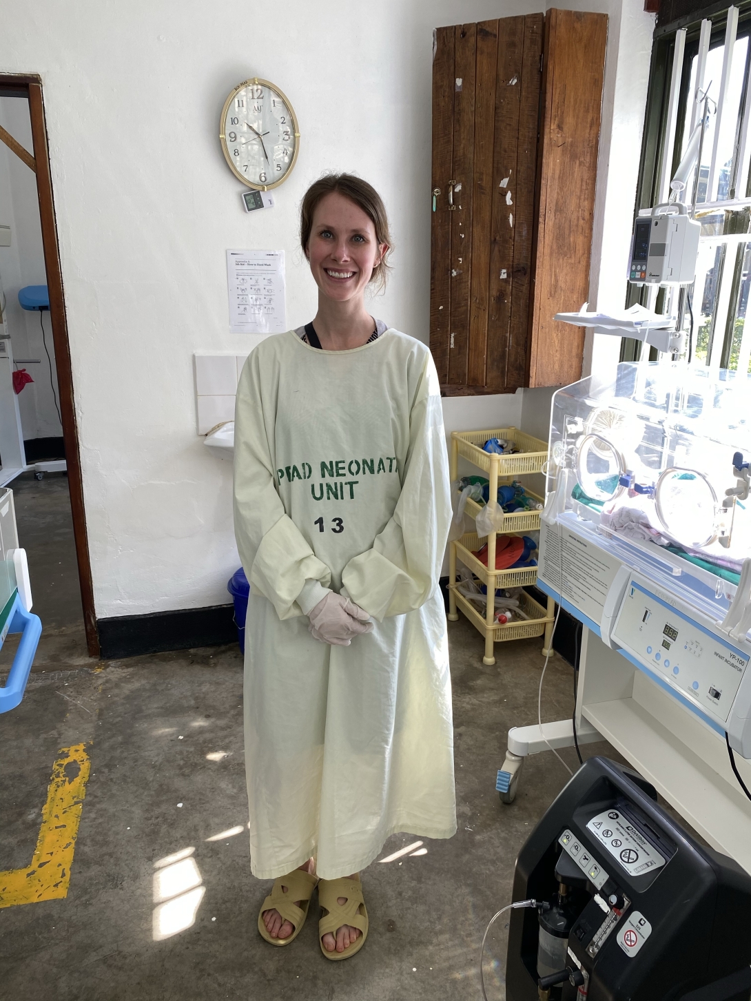 A Global Health provider smiles in a clinic