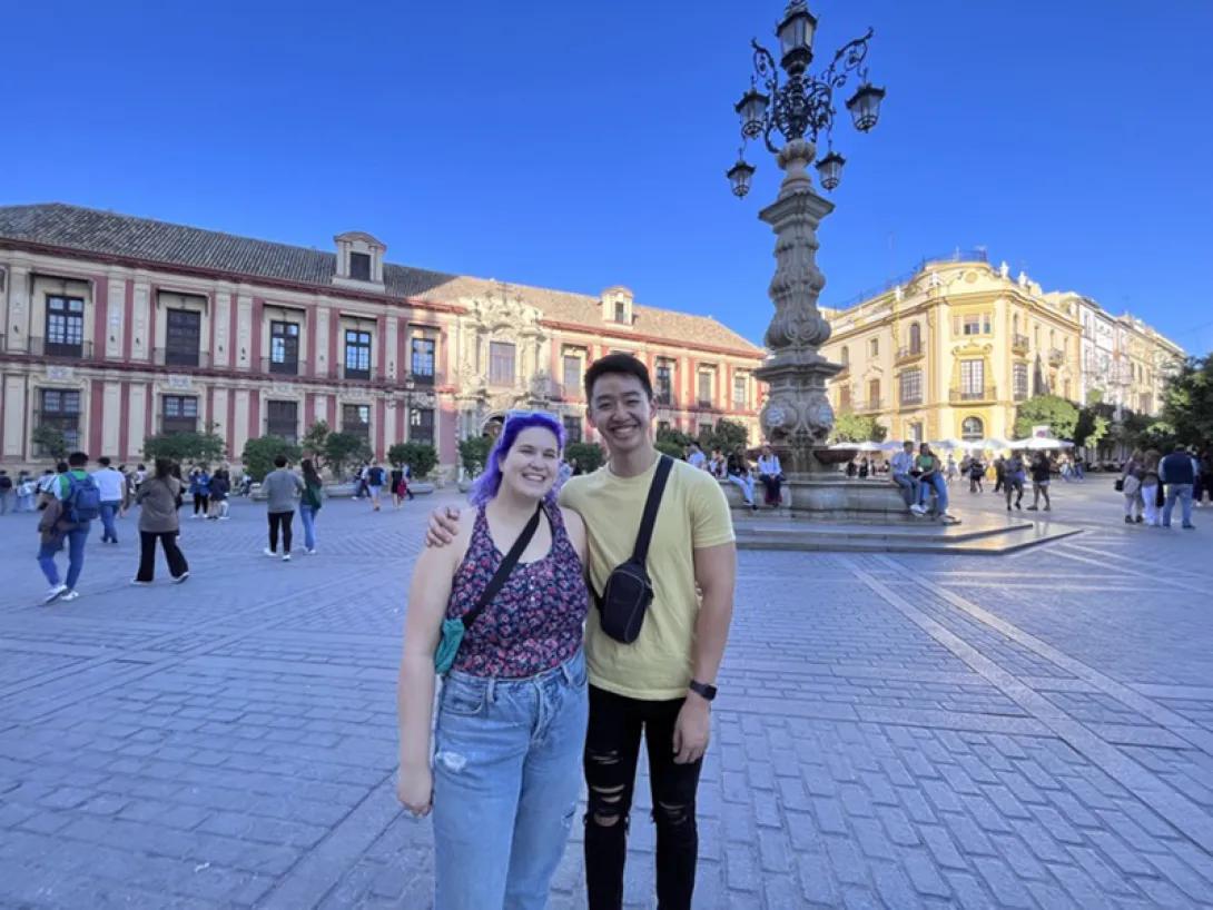 Lab member posing on a plaza