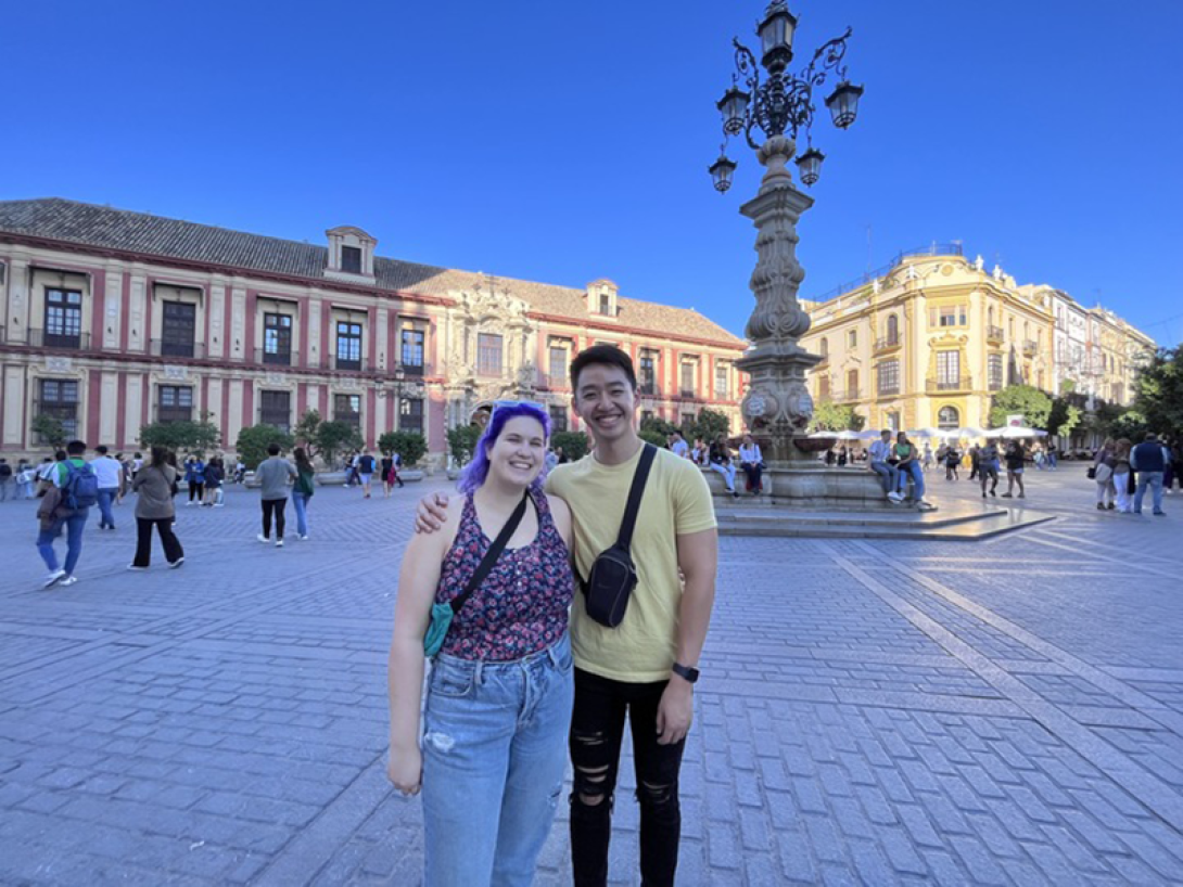 Lab member posing on a plaza