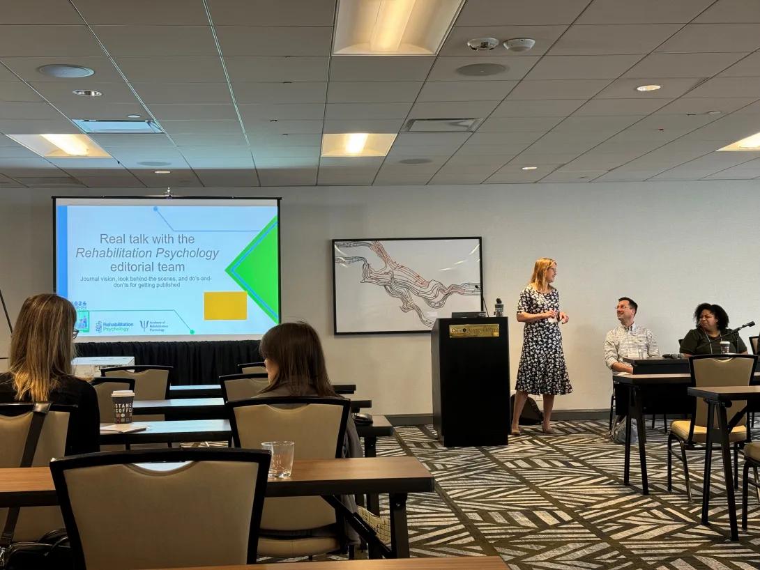 Dr. Kratz giving a presentation on journal editing at a conference