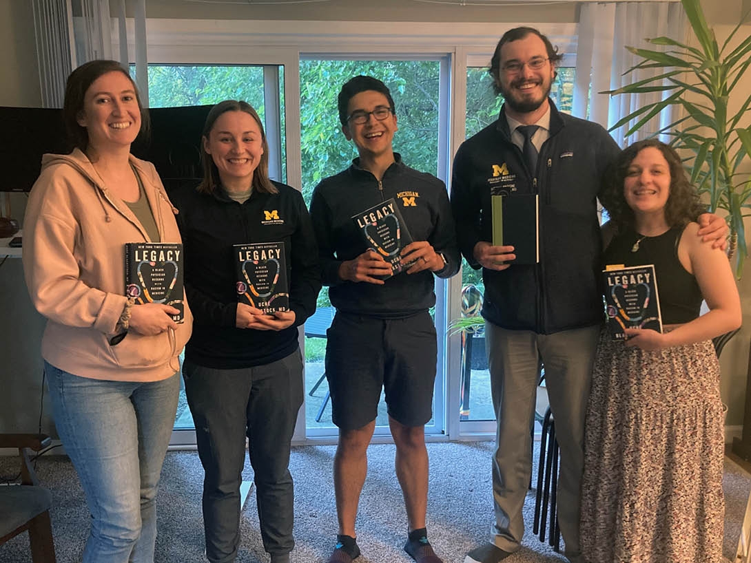 Residents holding their book, Legacy 