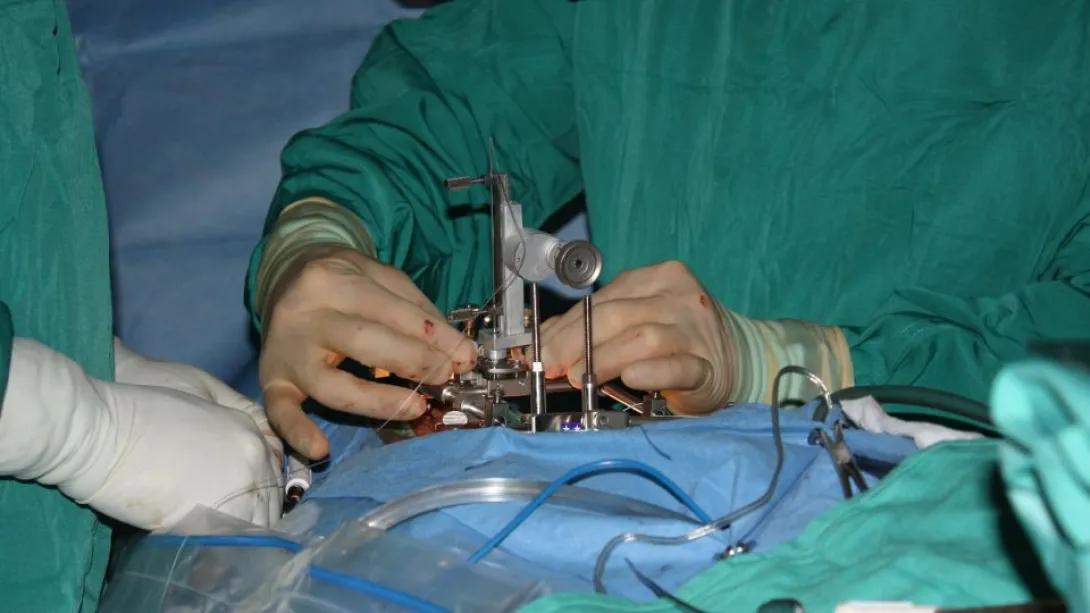 doctors transplanting stem cells into the spinal cord of an ALS patient, courtesy of CNN