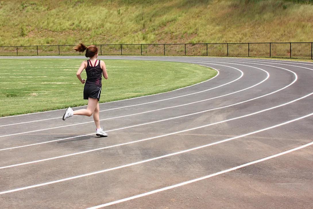 woman running on a track