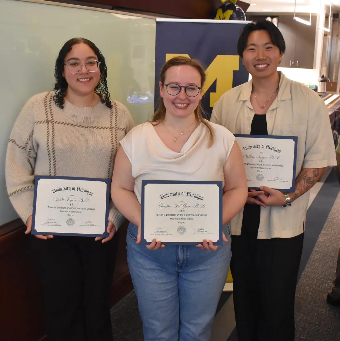 three phd graduates