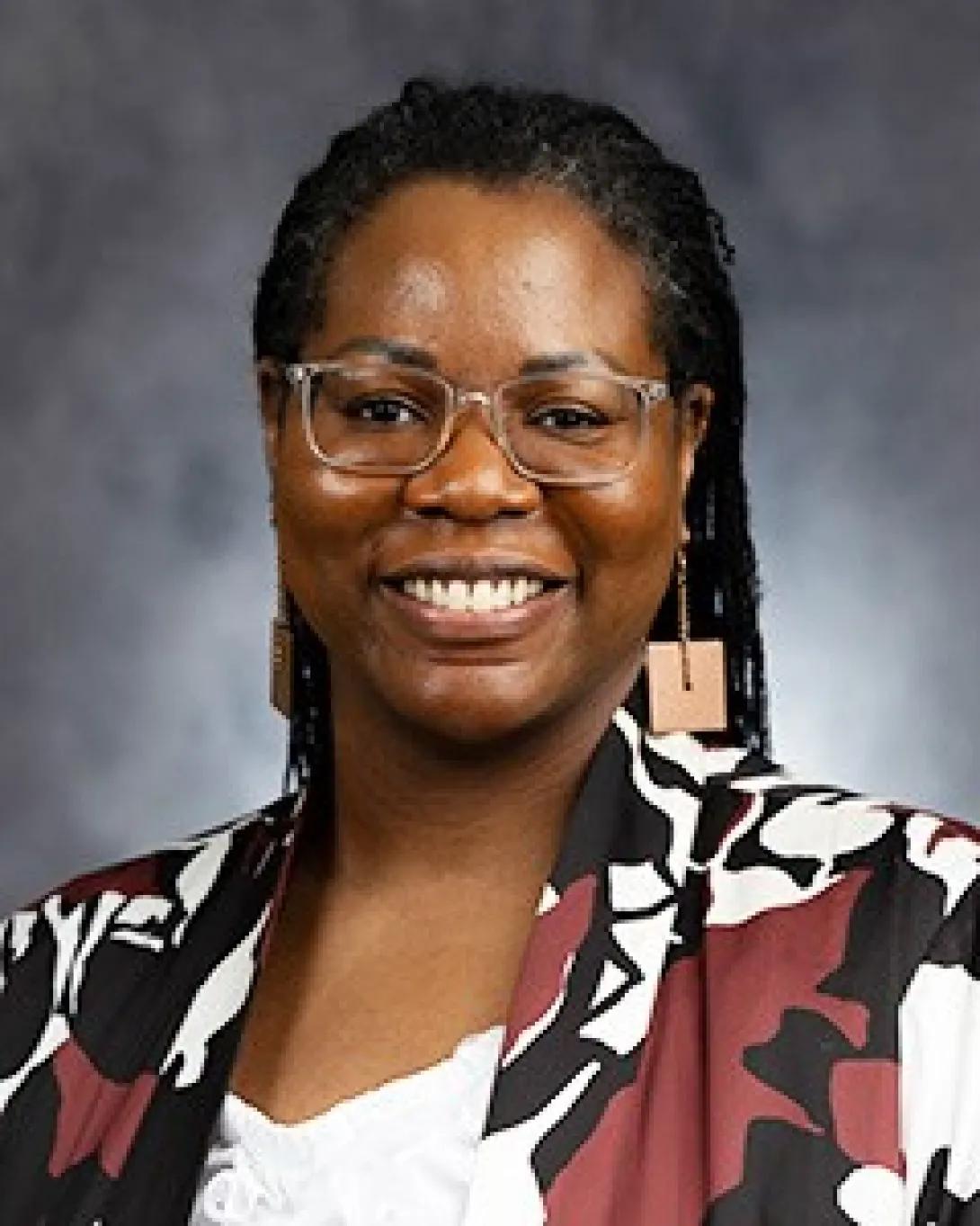 a Black woman wearing a red jacket 